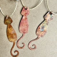Copper skinny cat with curled tail ornament, variety of three