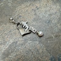 Freeform, Organic Sterling Necklace, tilted to left view.