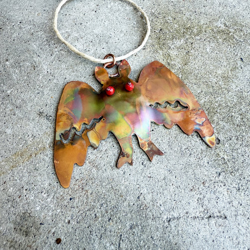 mothman copper ornament, flame patina, red glass bead eyes